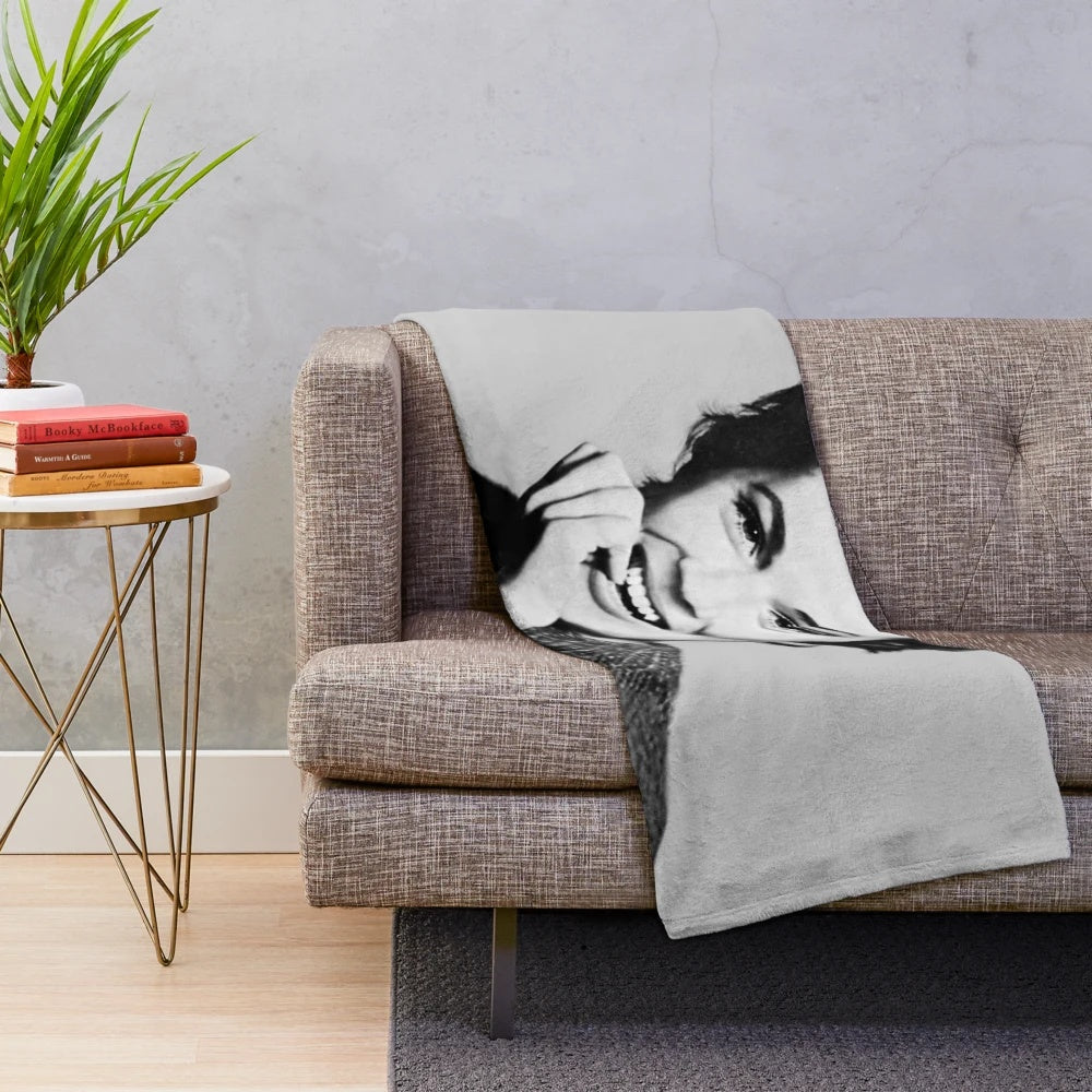 A plush, cozy blanket featuring a vintage-style portrait of actress Julie Andrews