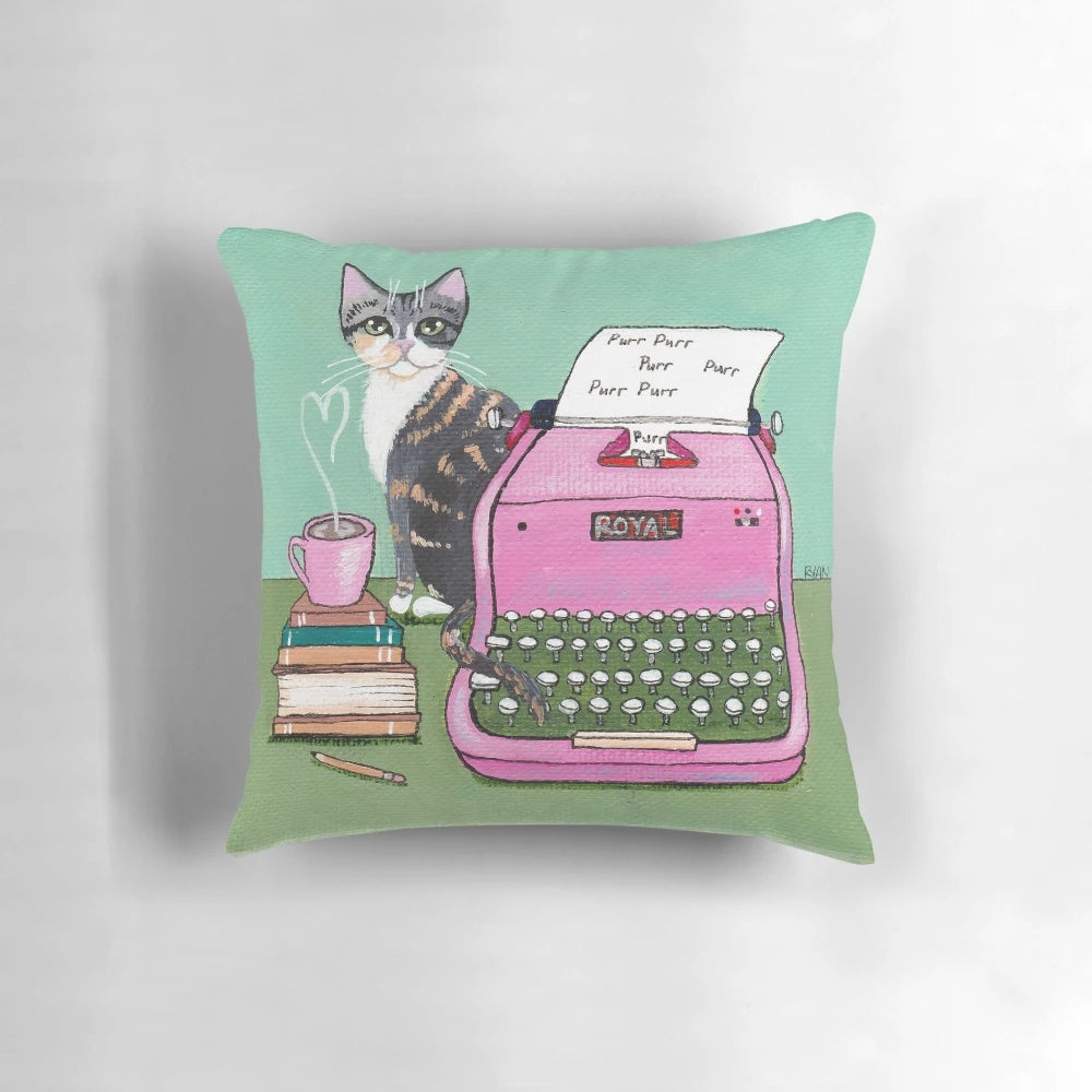 A pink-and-white decorative pillow with a handwritten "love note" design featuring an illustrated cat