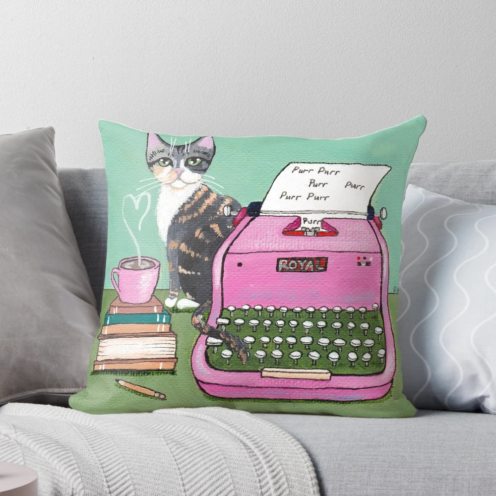 A pink-and-white decorative pillow with a handwritten "love note" design featuring an illustrated cat