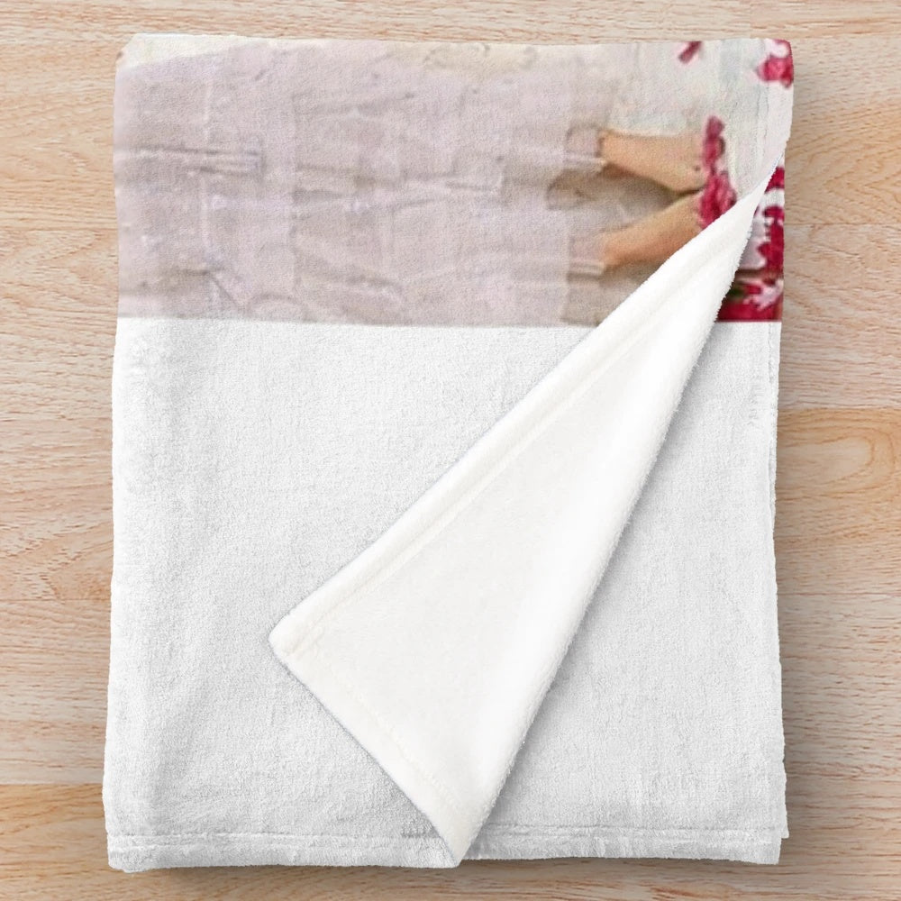 Vintage-style plush blanket featuring Mamma Mia movie characters and music