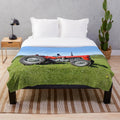 Vintage-inspired plush blanket featuring a Massey Ferguson 35 tractor design