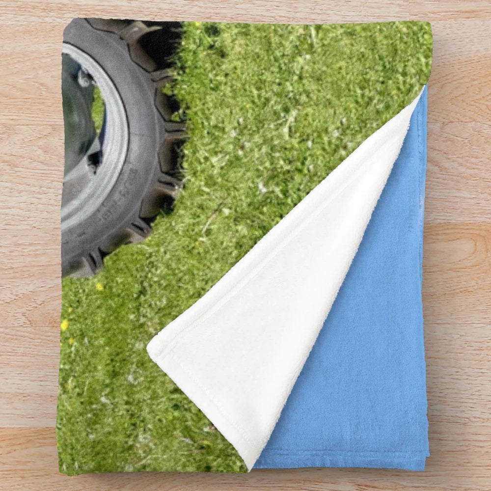 Vintage-inspired plush blanket featuring a Massey Ferguson 35 tractor design