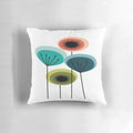 Vibrant mid century modern flower pillow featuring an abstract floral design in a retro 1960s style.