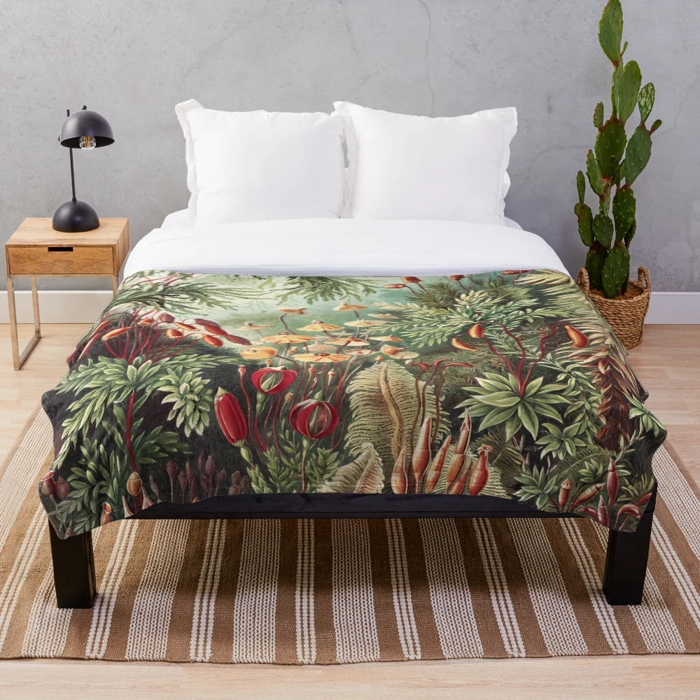 Vintage-inspired plush blanket featuring moss and floral designs, inspired by the botanical art of Ernst Haeckel