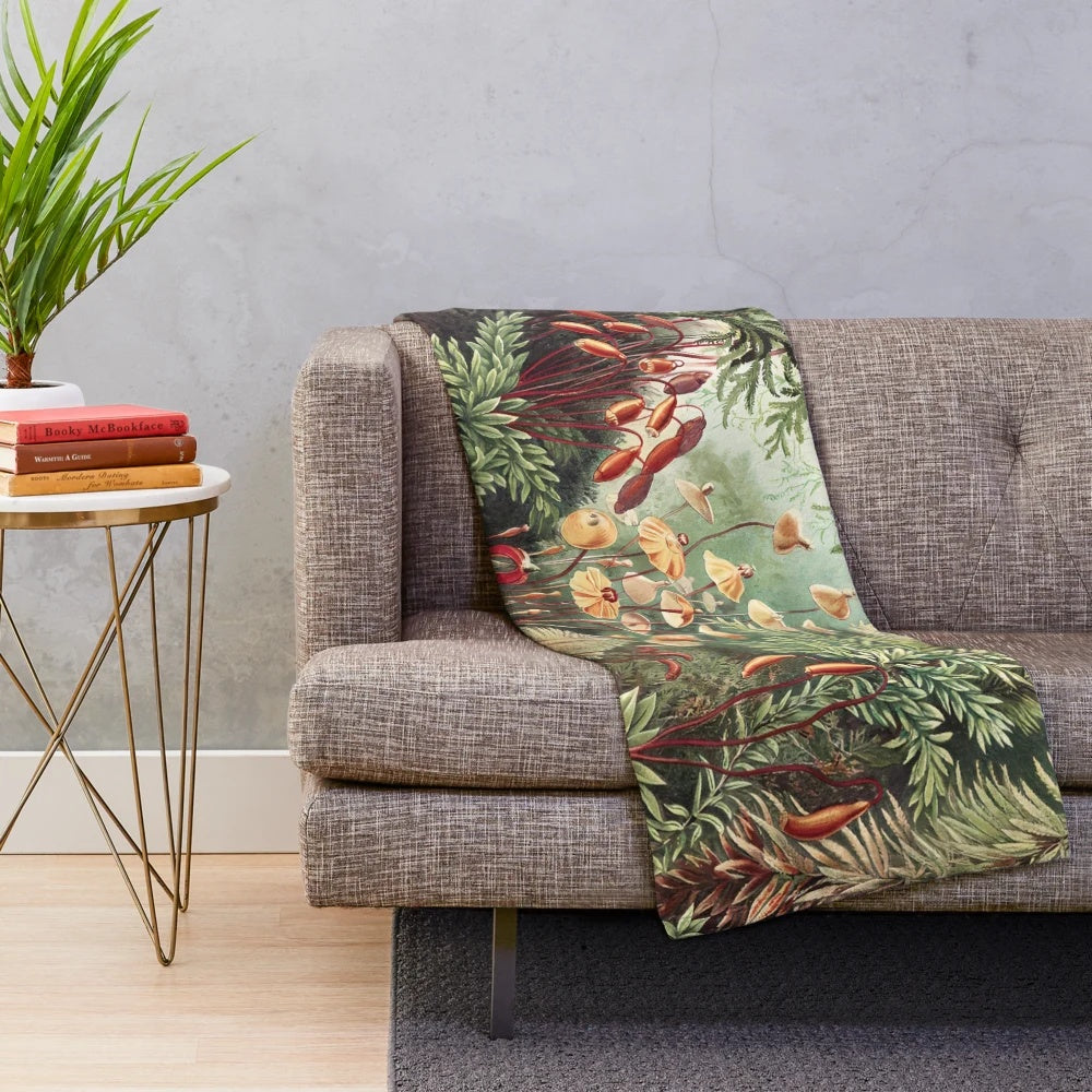 Vintage-inspired plush blanket featuring moss and floral designs, inspired by the botanical art of Ernst Haeckel