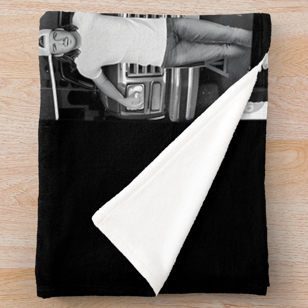 Vintage-inspired plush blanket featuring music artist logos and tour themes