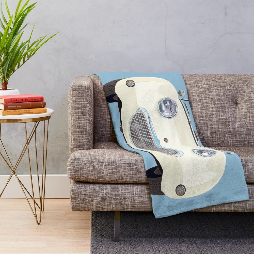 Vintage-inspired Old English White plush blanket featuring a frog/bug eye design inspired by the classic Austin Healey Sprite