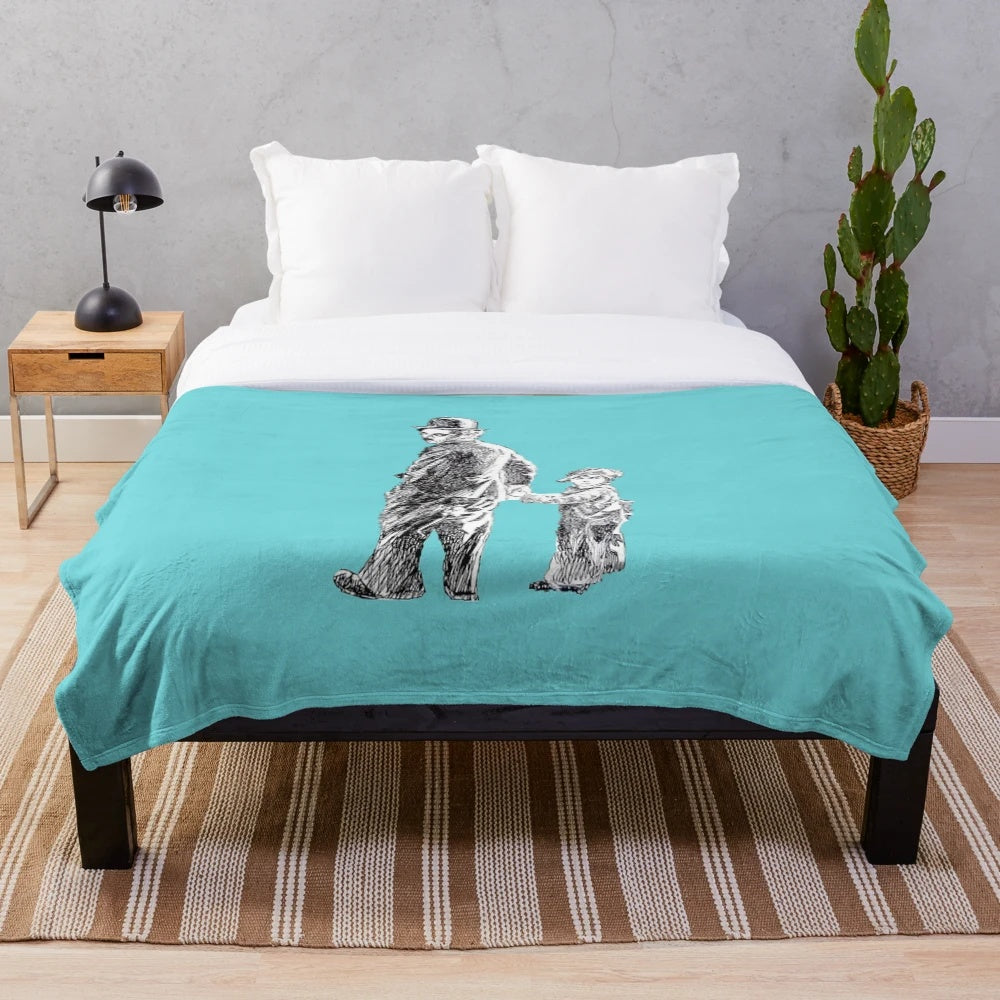 Vintage-inspired plush blanket featuring Charlie Chaplin's iconic "The Kid" character