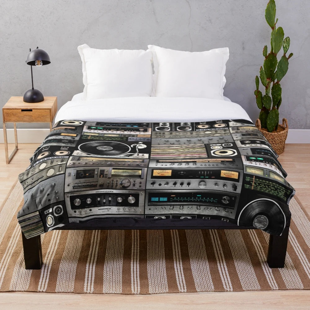 Vintage-inspired plush blanket with geometric pattern and analog music theme
