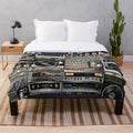 Vintage-inspired plush blanket with geometric pattern and analog music theme
