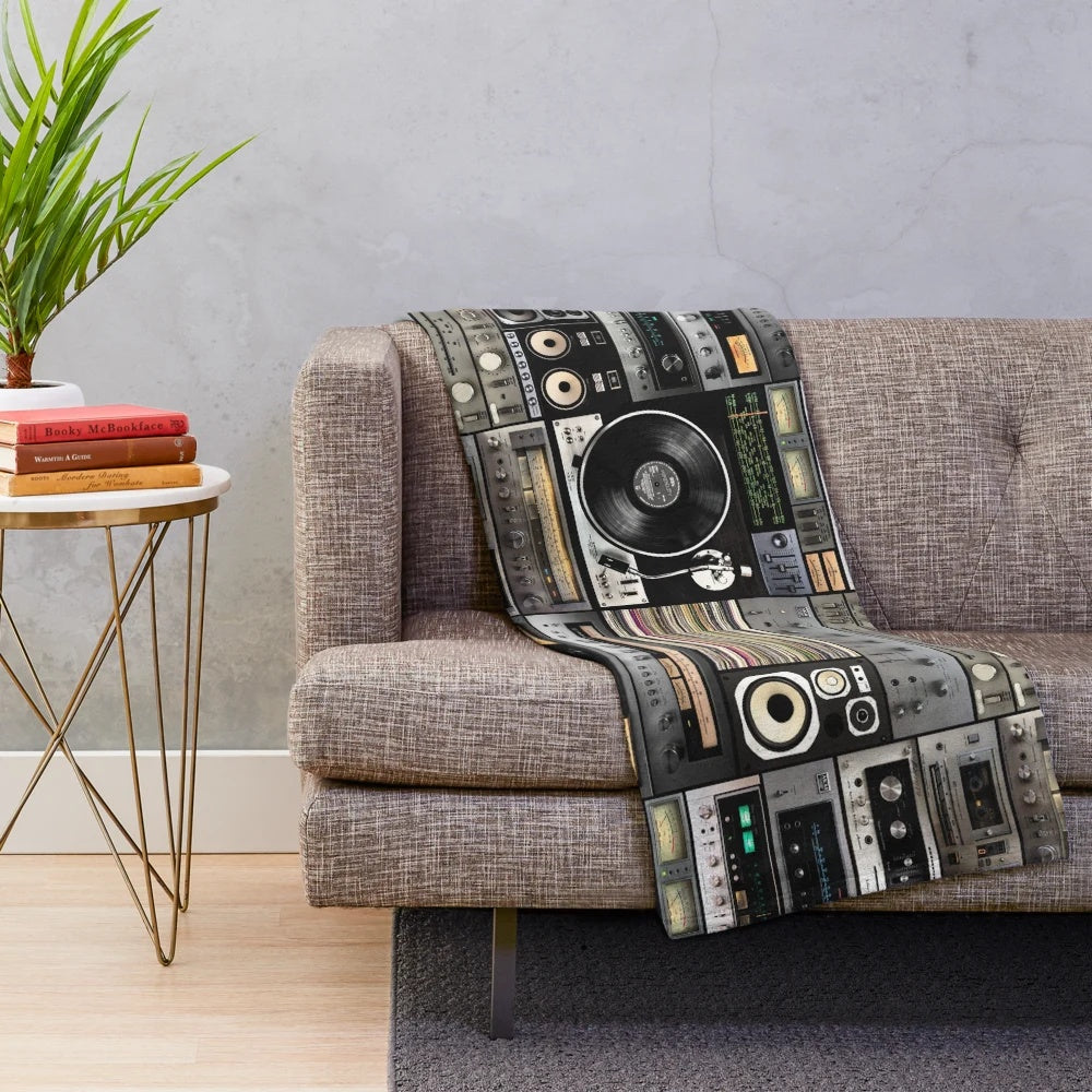 Vintage-inspired plush blanket with geometric pattern and analog music theme