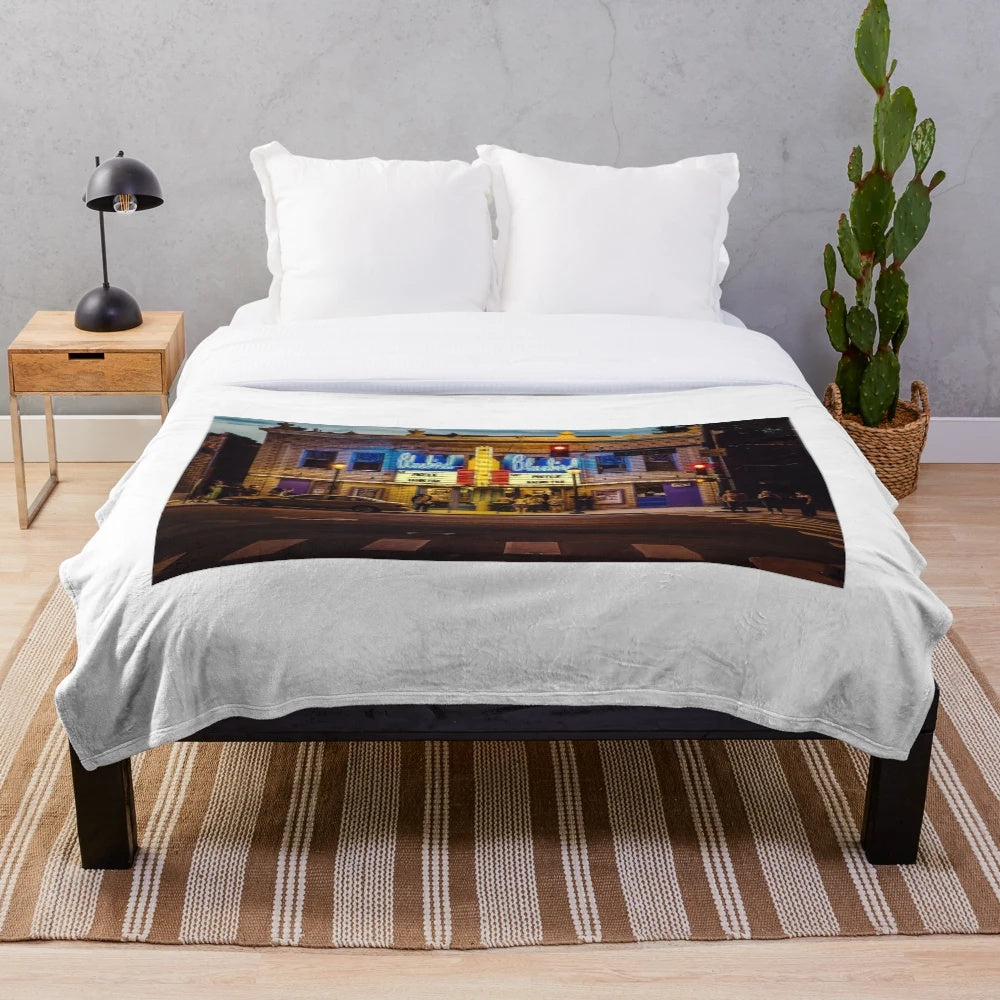 Retro plush blanket featuring classic cinema motifs