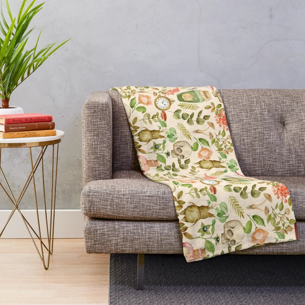 Vintage-inspired plush blanket featuring a floral and botanical design