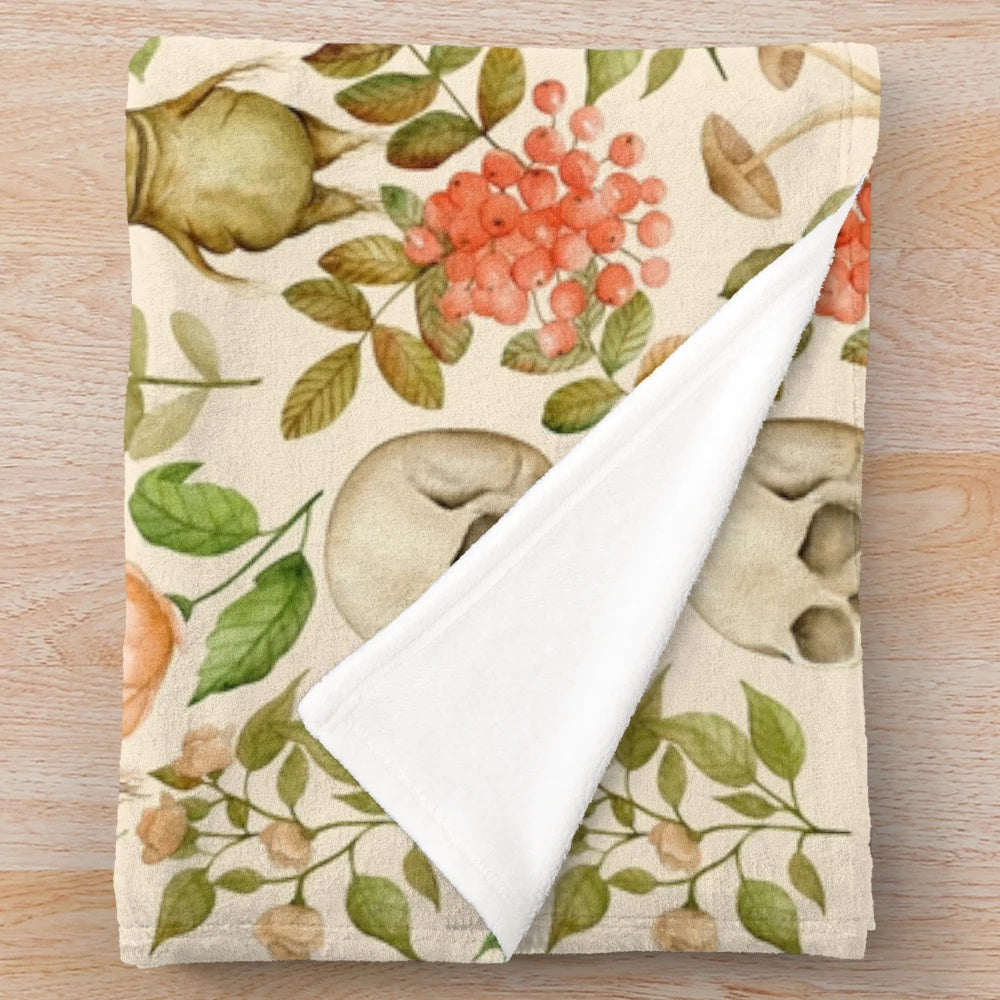 Vintage-inspired plush blanket featuring a floral and botanical design
