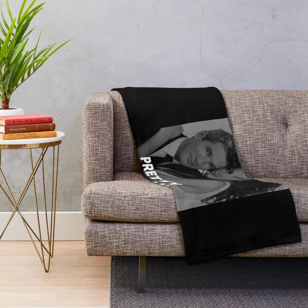 Vintage plush blanket featuring black and white movie scenes