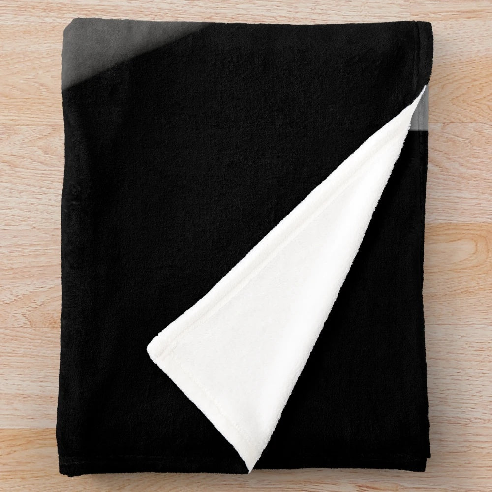 Vintage plush blanket featuring black and white movie scenes
