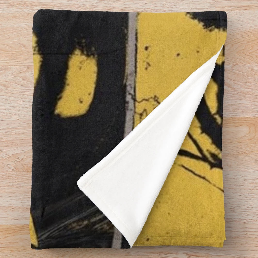 Vintage-inspired plush blanket with grunge music album cover design