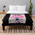 Cozy vintage-style plush blanket featuring The Regrettes band logo and design