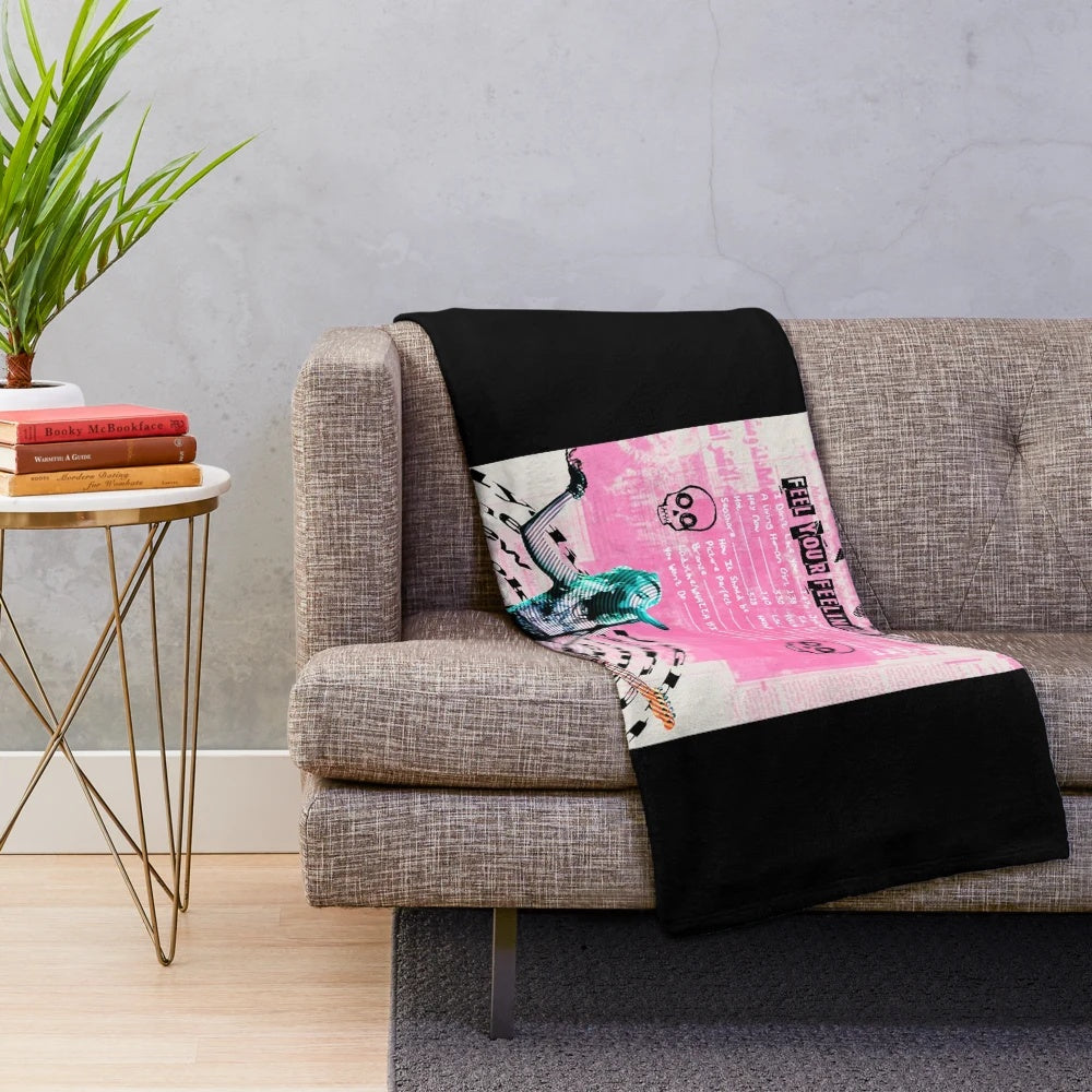 Cozy vintage-style plush blanket featuring The Regrettes band logo and design