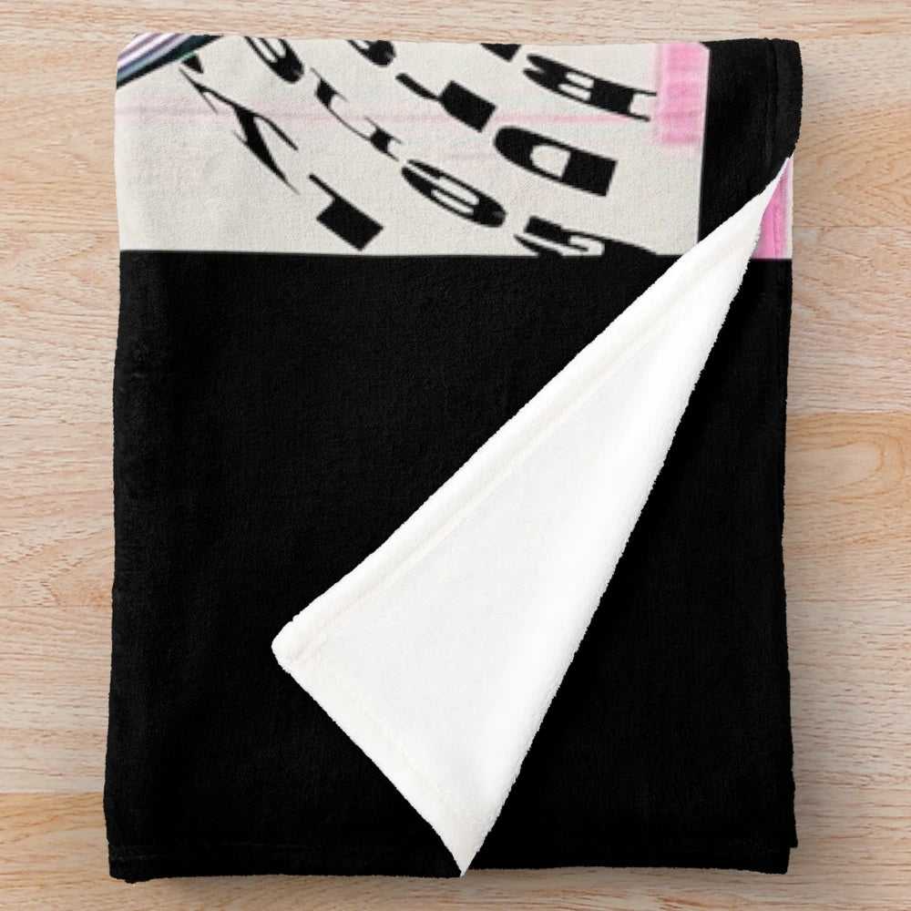 Cozy vintage-style plush blanket featuring The Regrettes band logo and design