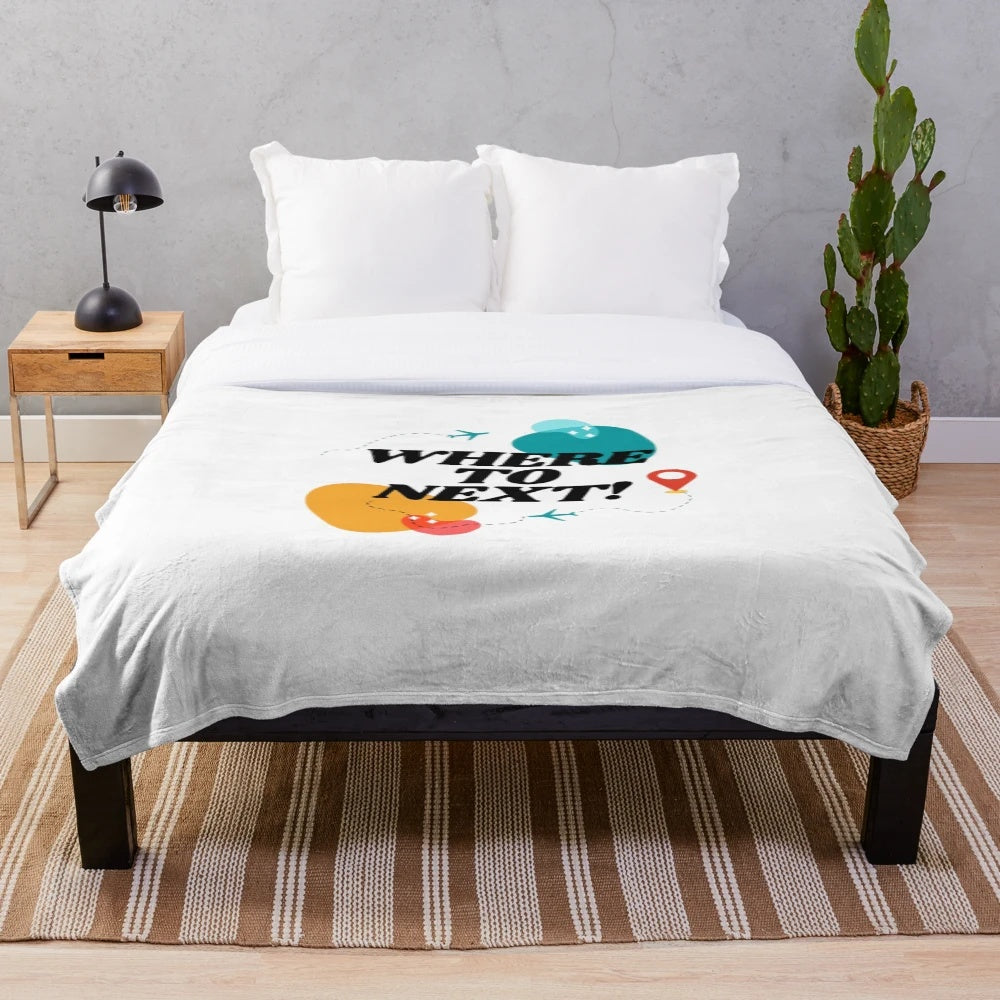 Vintage-inspired plush blanket with airplane and travel motifs