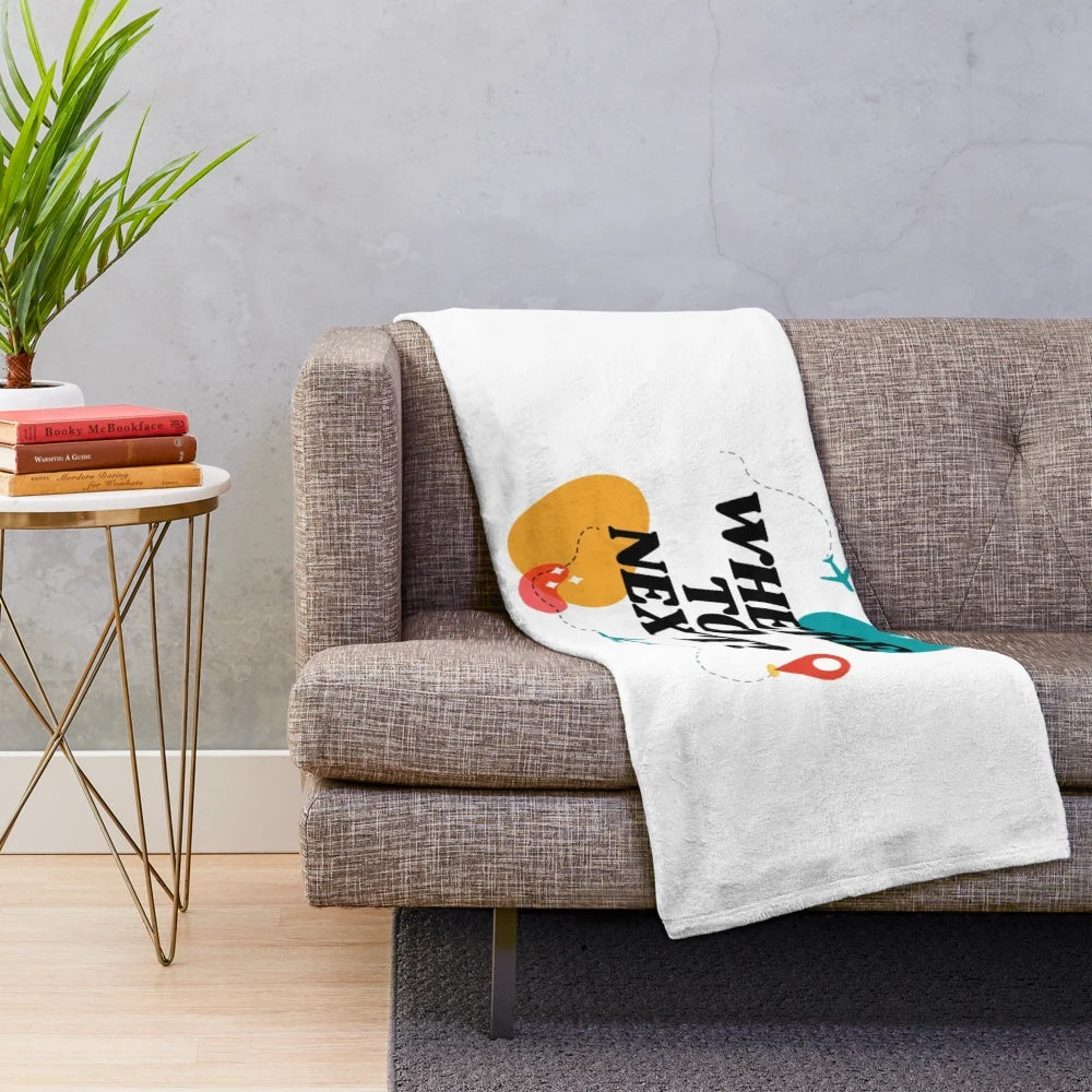 Vintage-inspired plush blanket with airplane and travel motifs