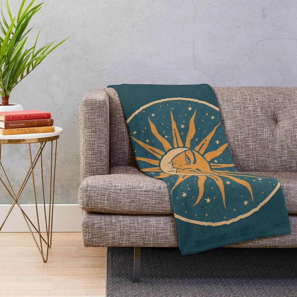 Vintage-style plush blanket featuring a sun and moon celestial art design