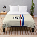 Vintage-inspired plush blanket featuring a classic car design