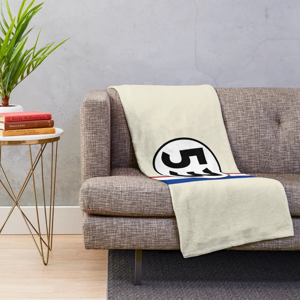 Vintage-inspired plush blanket featuring a classic car design