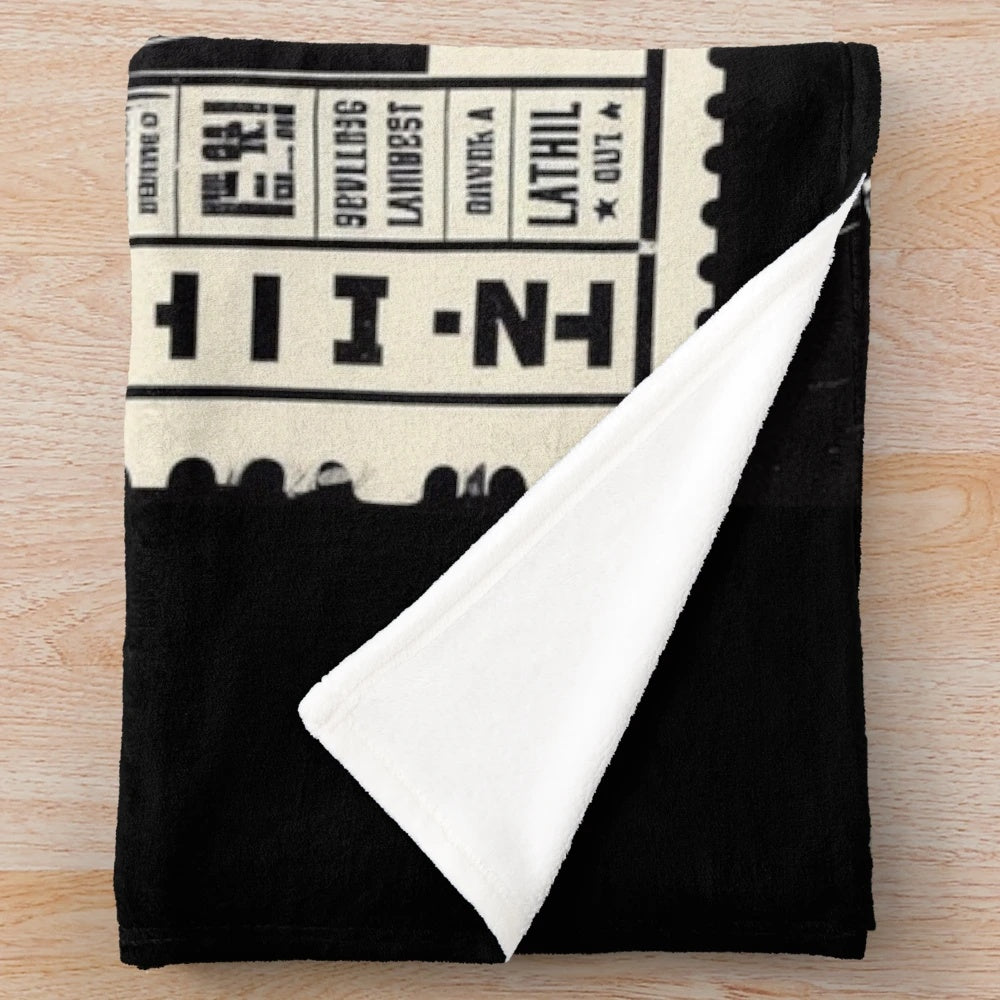 Vintage-inspired plush blanket featuring classic cinema ticket design