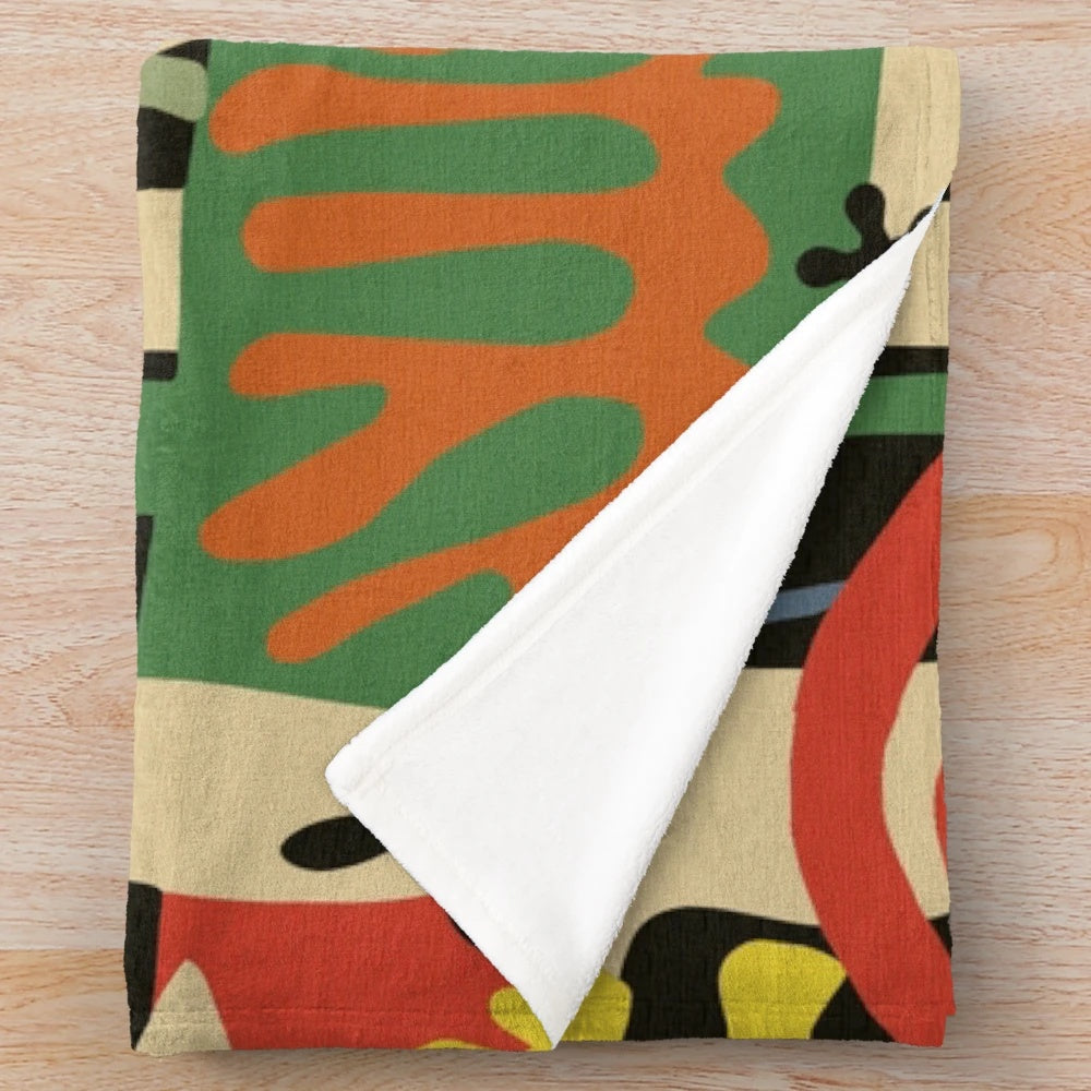 Vintage-inspired plush blanket with Matisse-inspired abstract design