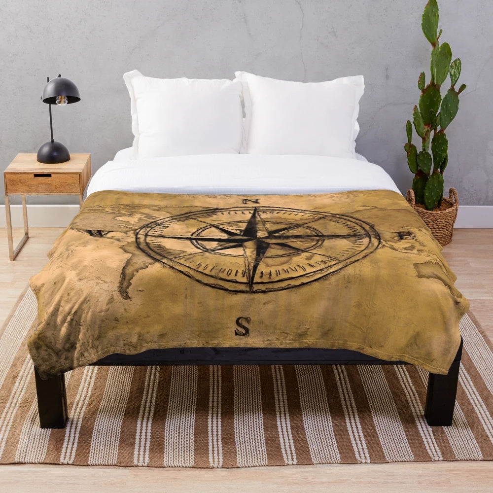 Plush blanket featuring an old world map design and compass rose
