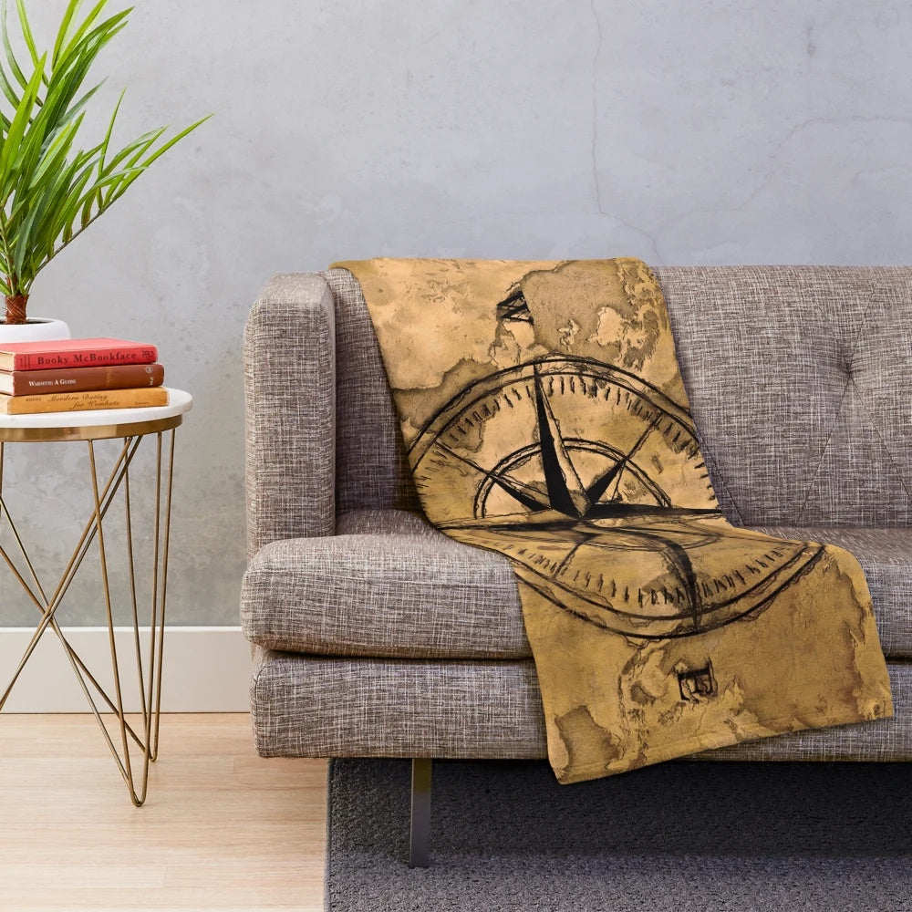 Plush blanket featuring an old world map design and compass rose