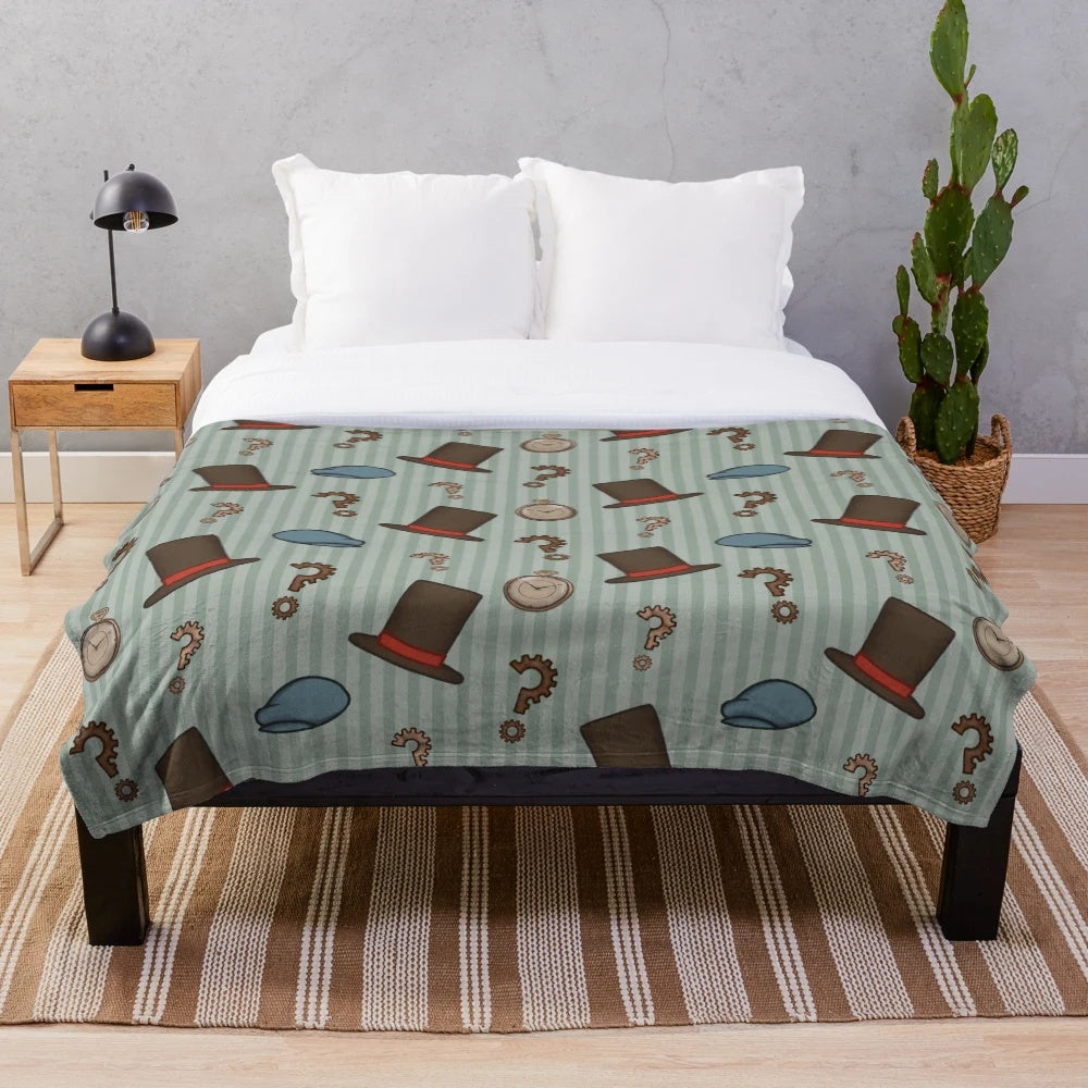 Cozy plush blanket featuring a repeated pattern inspired by the Professor Layton video game series