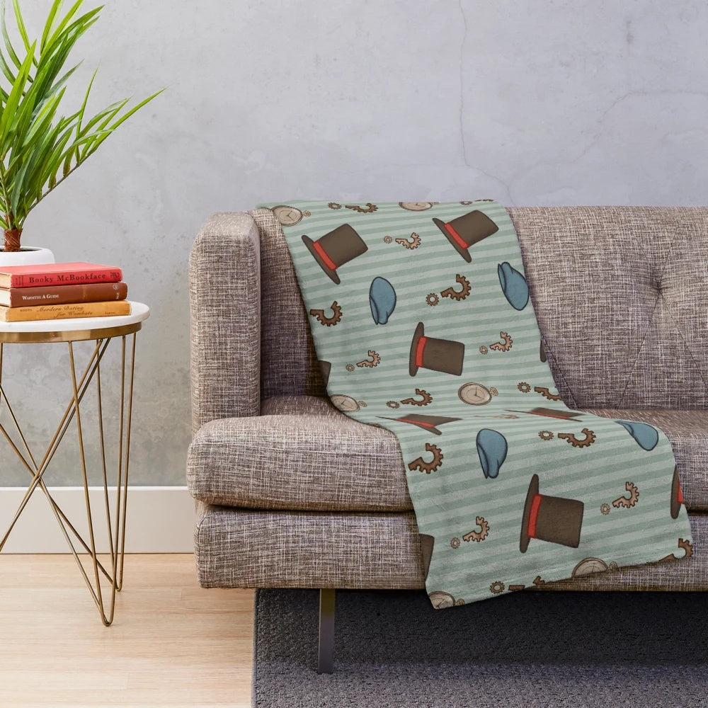 Cozy plush blanket featuring a repeated pattern inspired by the Professor Layton video game series