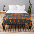Retro orange leaves pattern on a grey plush blanket