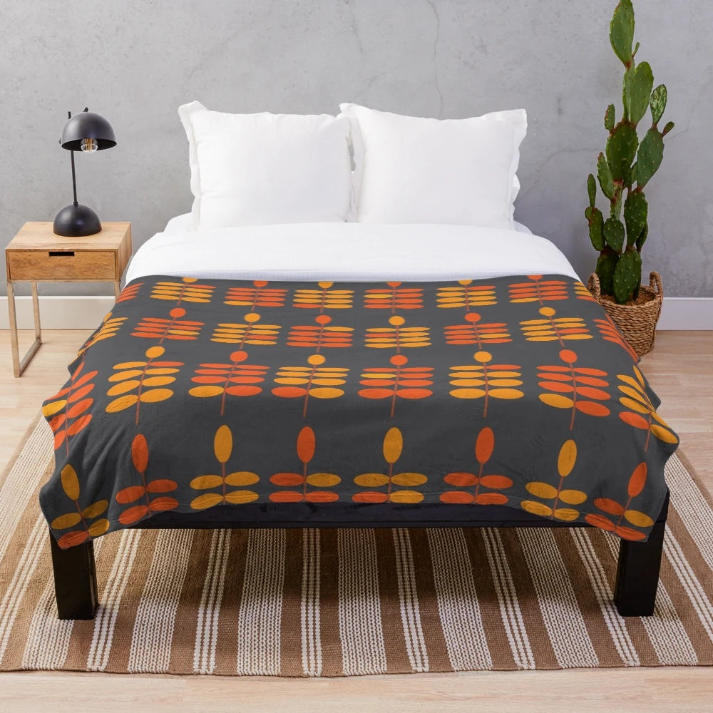 Retro orange leaves pattern on a grey plush blanket