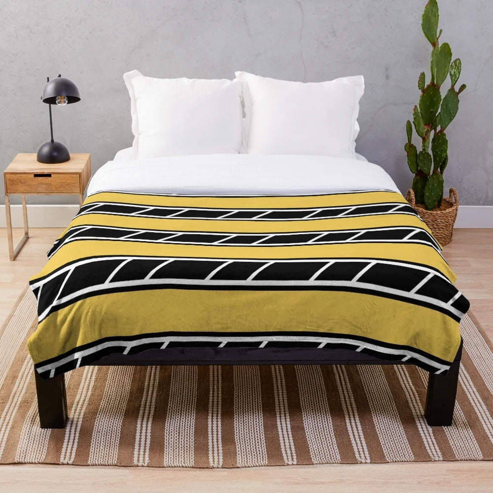 Retro-style plush blanket in black and yellow with classic motorcycle graphics
