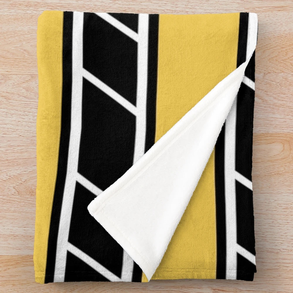 Retro-style plush blanket in black and yellow with classic motorcycle graphics