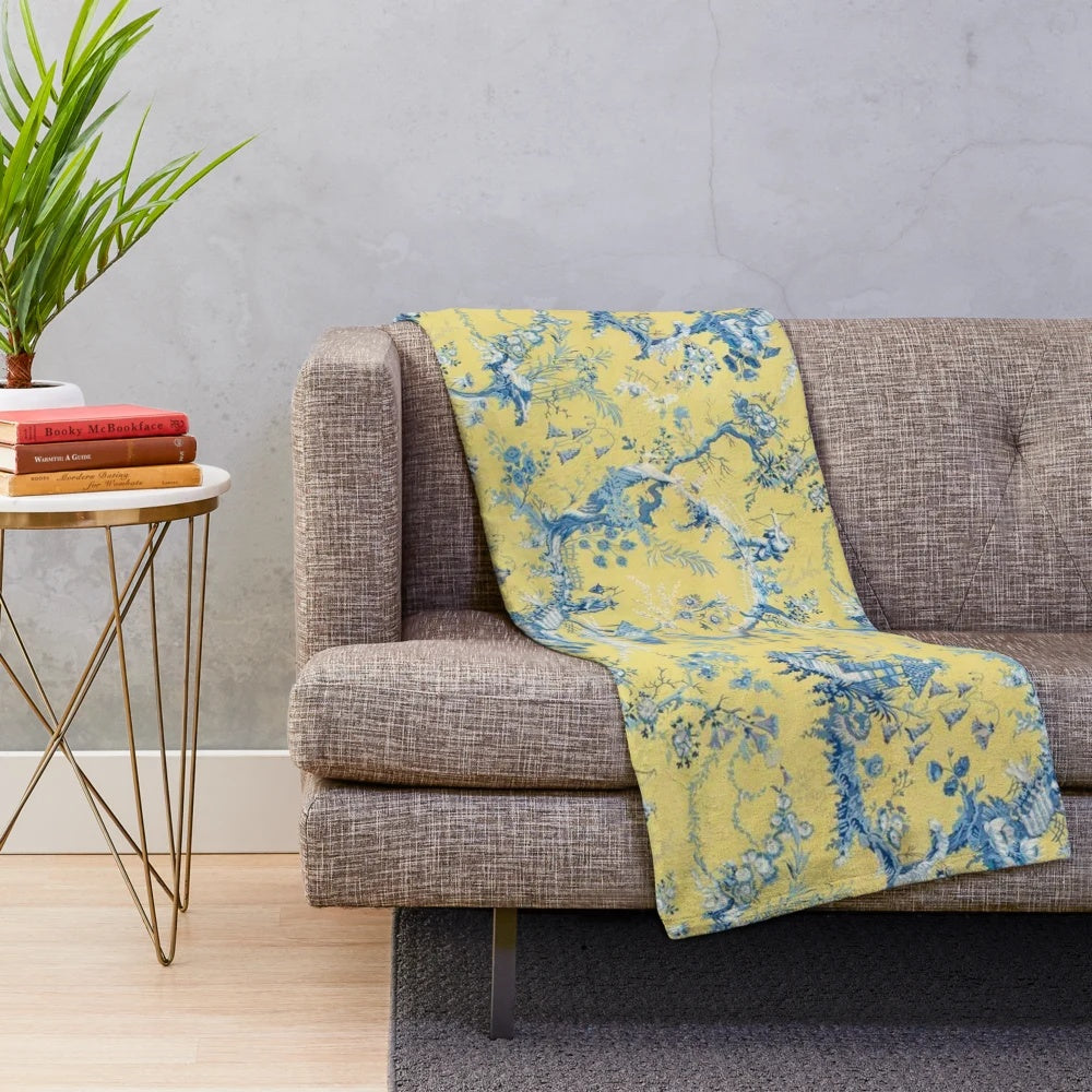 Vintage-inspired blue and yellow toile plush blanket with scenic chinoiserie pattern