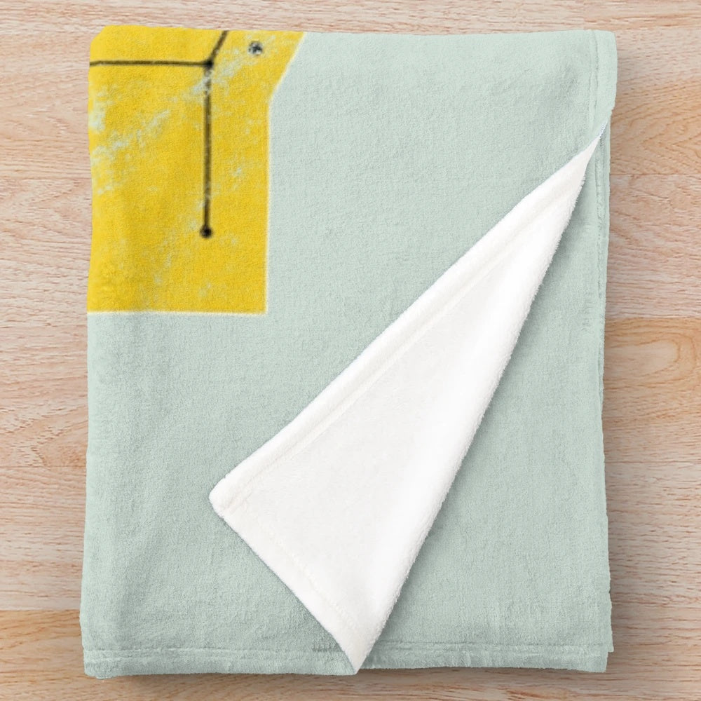 Topo Chico mineral water-inspired plush blanket with a worn, vintage design