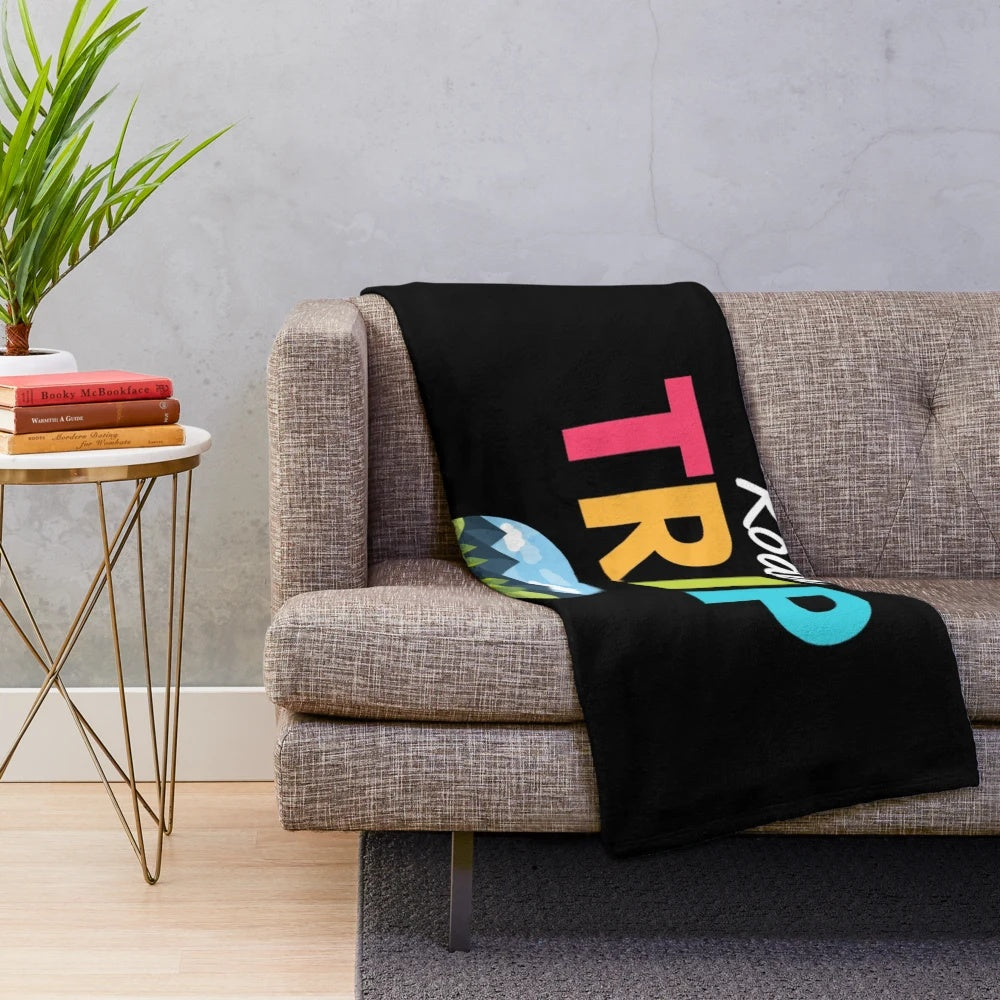 Vintage-inspired travel plush blanket featuring blue mountains and retro road trip design