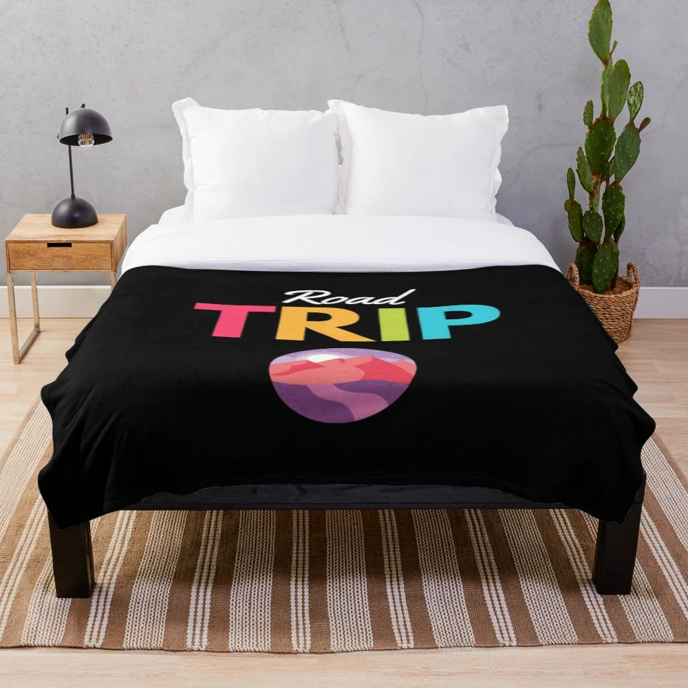 Vintage-inspired travel-themed plush blanket featuring mountain landscape