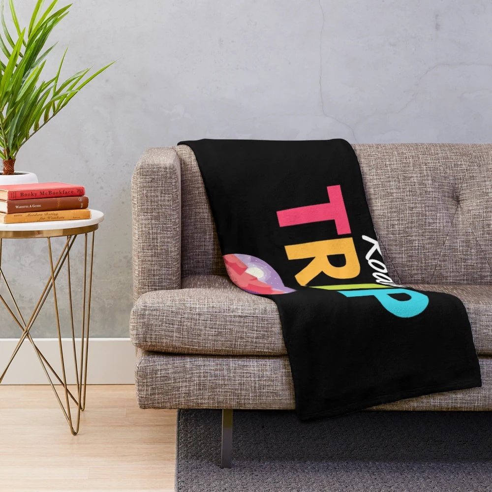 Vintage-inspired travel-themed plush blanket featuring mountain landscape