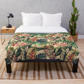 Vintage-inspired tropical floral plush blanket with jungle leaves and flowers