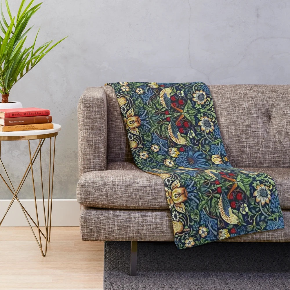 Vintage-inspired plush blanket featuring the William Morris "Strawberry Thief" floral pattern