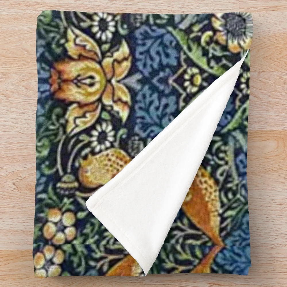Vintage-inspired plush blanket featuring the William Morris "Strawberry Thief" floral pattern