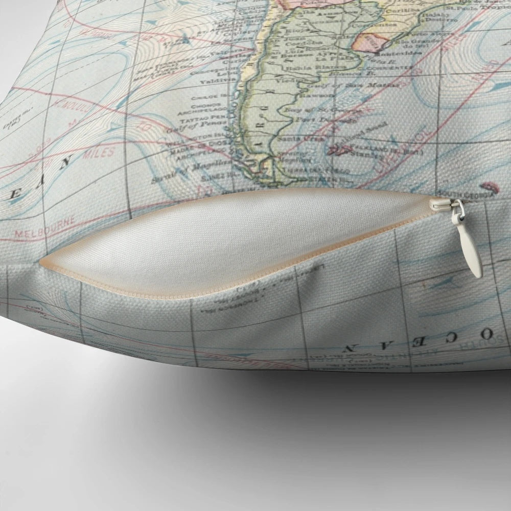 Decorative vintage-style world map printed on a cozy pillow