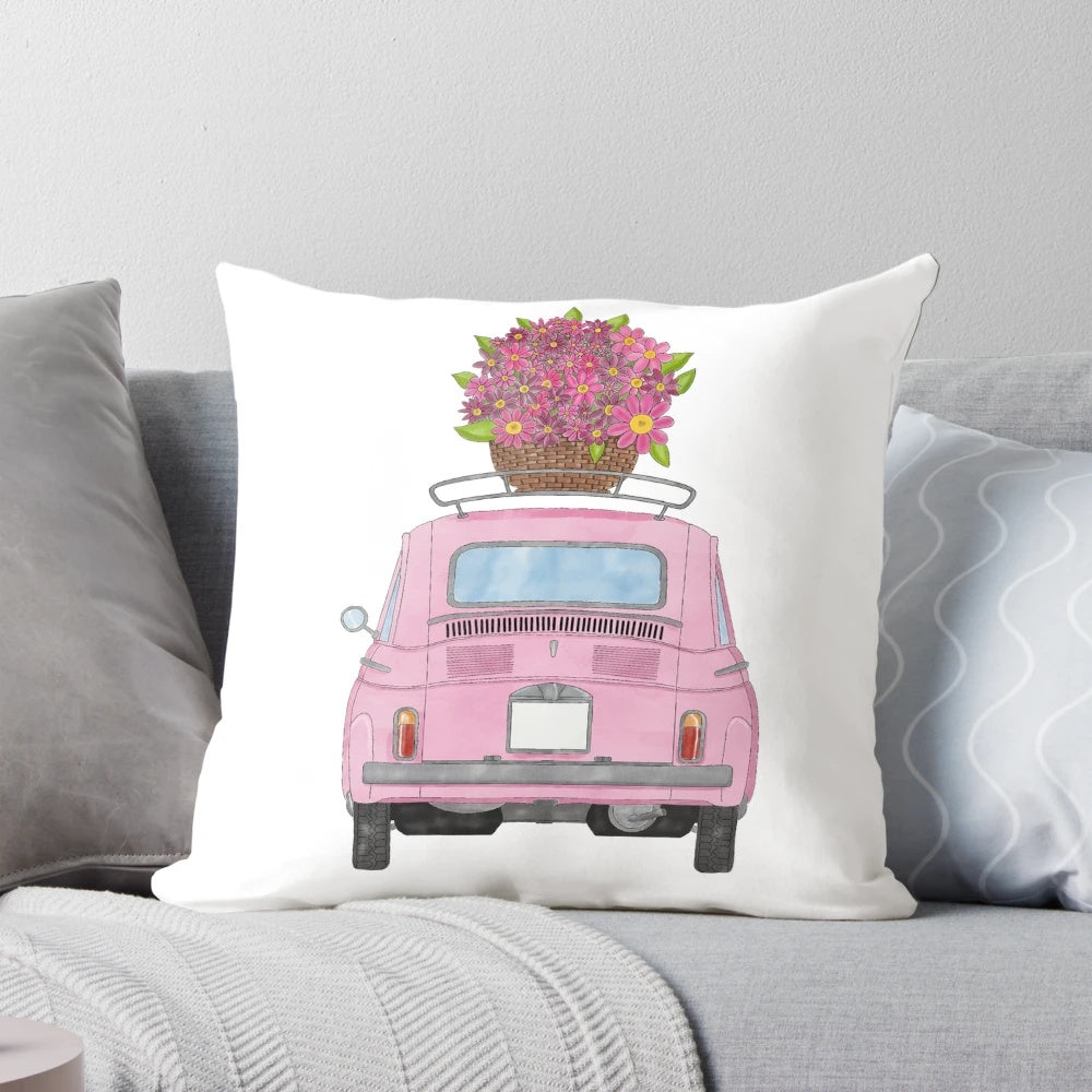 A pink Fiat 500 classic car illustrated with watercolor flowers on a decorative throw pillow.