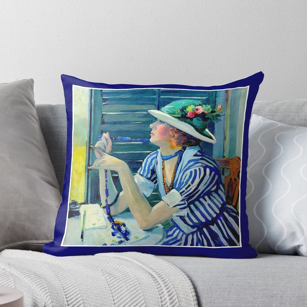 Vintage Jane Peterson oil painting print of a young woman with a floral hat and beaded necklace, featured on a decorative pillow.